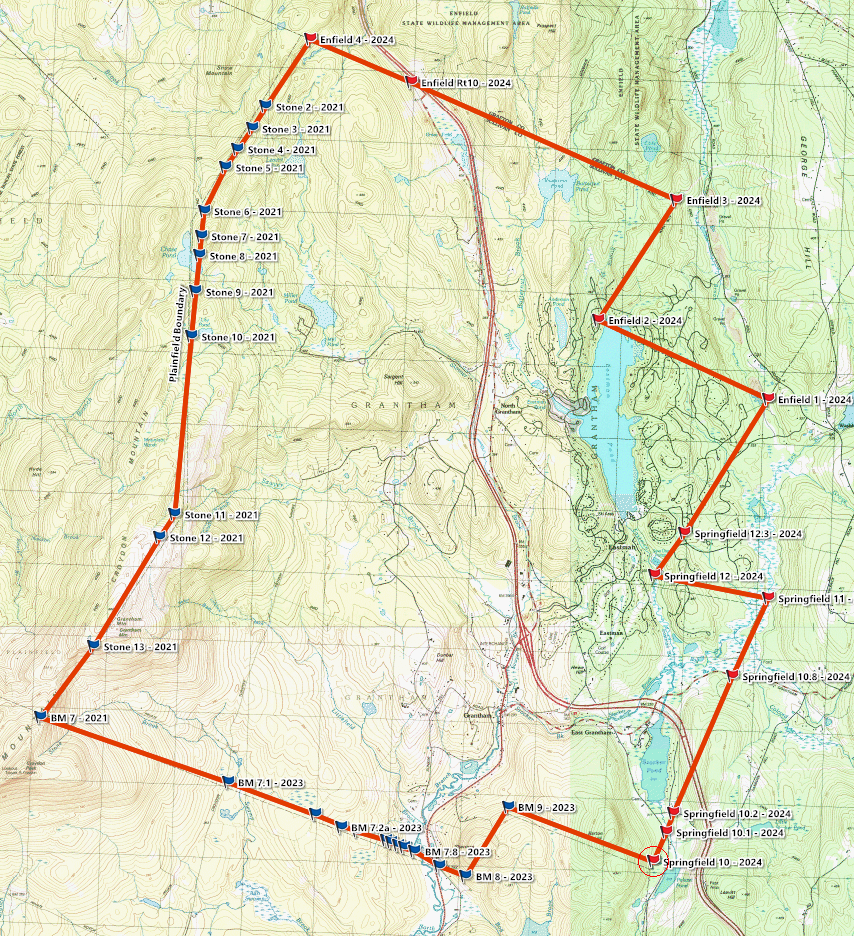 Topographic map of Grantham showing a large, irregular polygon outlined in red connecting survey points labeled by year (2021–2024). The western side follows a north–south line of “Stone” markers along the Plainfield boundary, while the eastern side zigzags through “Enfield” and “Springfield” points near a river valley and lake. Additional benchmark points (“BM”) appear along the southern edge. Contour lines, roads, water bodies, and town names provide terrain context.